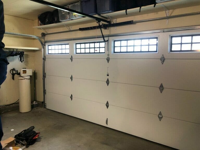 Amarr Heritage 3000 Long Panel Beadboard Sandtone from the inside of the garage