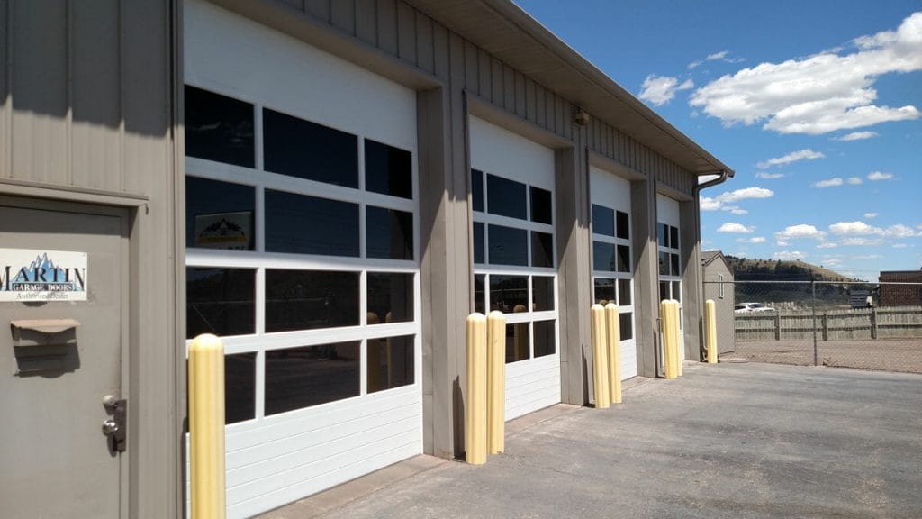 three commercial sectional doors with fullview sections installed.