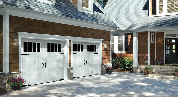 Amarr Classica Garage Door Carriage House Installed on a house. Two side by side.