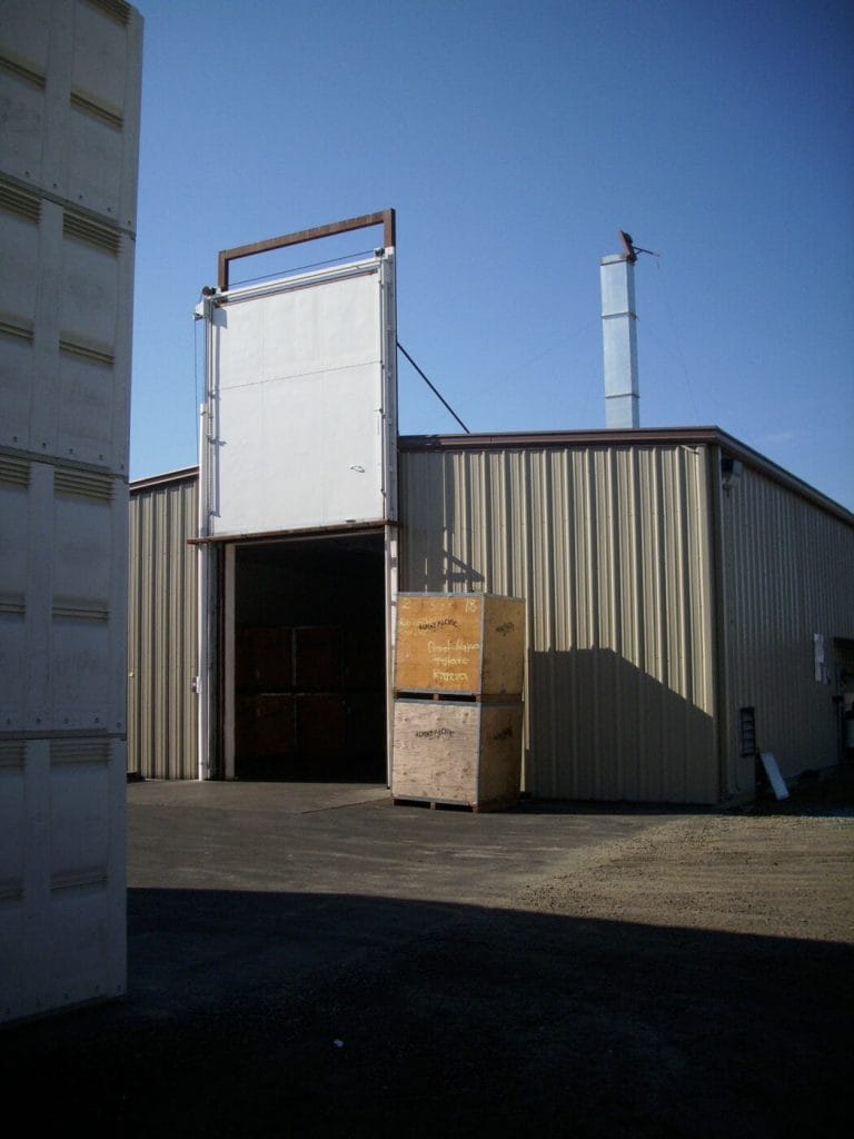 building at almond huller with door raised