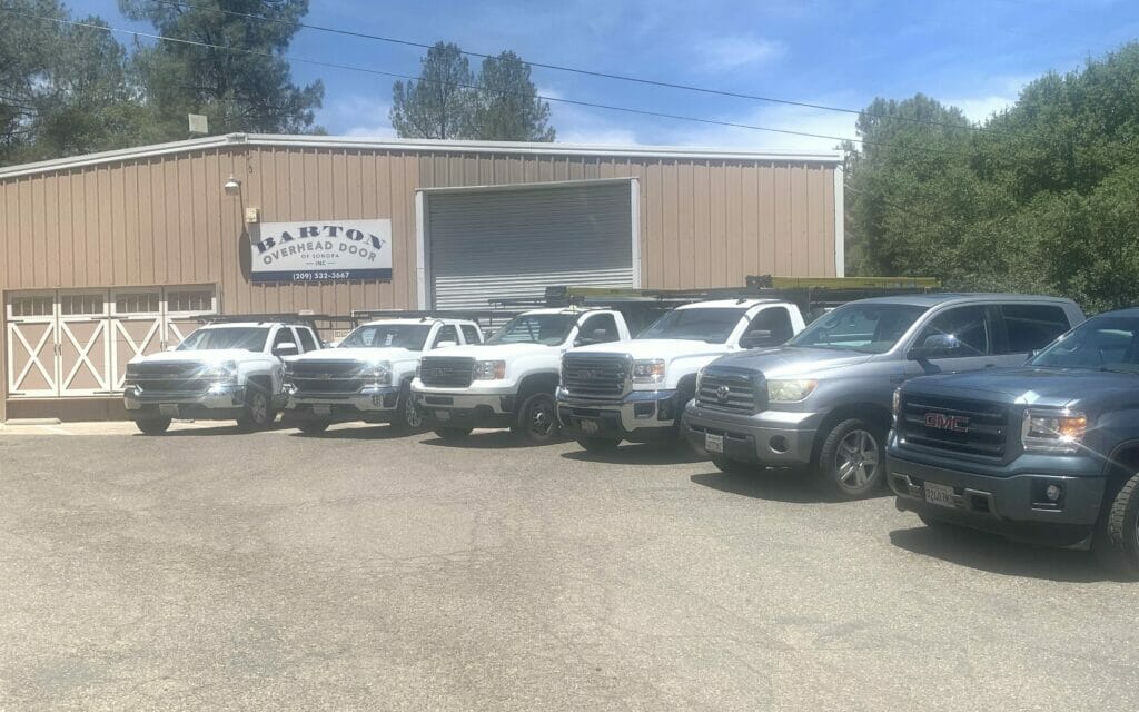 Trucks parked in front of the Barton Overhead Door Sonora Showroom.