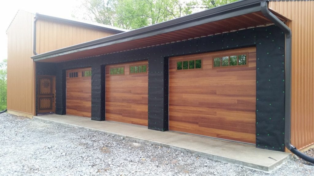 Three Accent garage doors installed with windows
