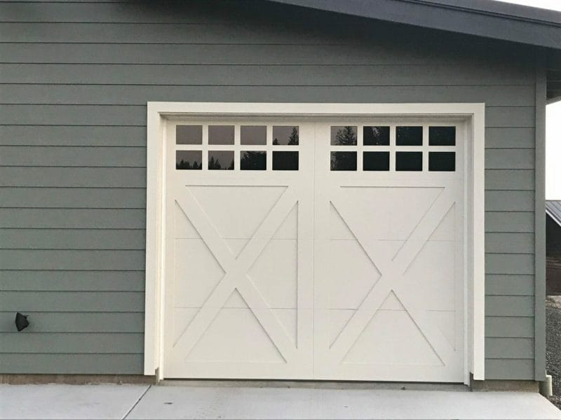 Closeup of a carriage house door installed on a shop.